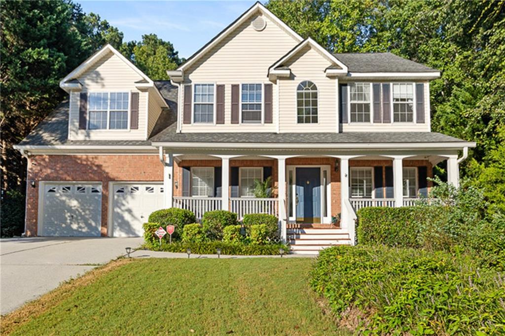 Welcome to this picture-perfect 2-story traditional home nestled on 1.37 acres, where timeless charm and everyday comfort come together in the most inviting way. A classic rocking chair front porch sets the stage for relaxed mornings and cozy evenings, while inside you’re greeted with spacious living that includes 4 bedrooms, 2.5 baths, and both a formal dining room and formal living room designed for gathering with family and friends. At the heart of the home, the welcoming family room with its fireplace flows into the cheerful eat-in kitchen, beautifully appointed with white cabinetry, granite countertops, a breakfast bar, and a sunlit breakfast nook with a built-in desk that makes the space as functional as it is charming. Upstairs, the oversized owner’s retreat feels like a true getaway with its tray ceiling, private sitting area, and spa-like bath featuring dual vanities, a soaking tub, and a separate shower. Secondary bedrooms are comfortably sized, offering flexibility for family, guests, or hobbies. The partial basement adds even more versatility with flex space perfect for a playroom, office, or media room. Outdoors, a spacious deck overlooks your very own backyard oasis with a sparkling inground pool, creating the ideal setting for summer fun, weekend barbecues, and countless memories with loved ones.