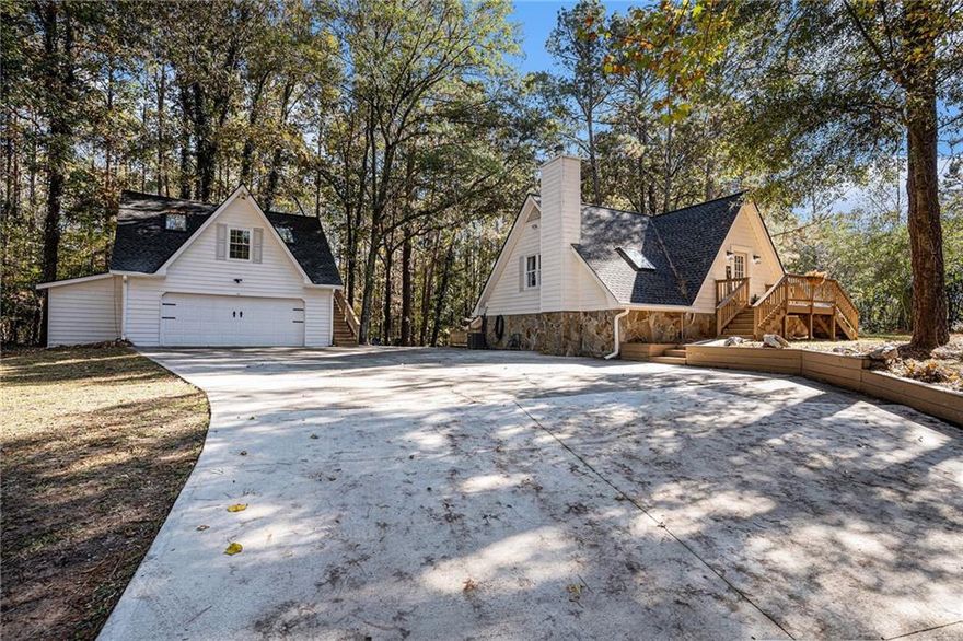 Rare Opportunity! * Remodeled North Georgia A-frame Chalet-Style Home Located in Middle Georgia * Move-in Ready * No HOA * Cozy Home With Wood Stove * Welcoming Sunroom* Features Open Living Area * Seamless Flow to Expansive Decks * Perfect for Gatherings or Quiet Evening * Fire Pit * Almost an Acre of Privacy * Built for Efficiency for Low Utility Bills * Detached Carriage House * In-Law Suite Perfect for Guest, Extended Family or Creative Studio * All New Roof * Too Many Upgrades to List Here * Almost an Acre of Private Yard Space * Feelings of Peaceful Suclusion While Just Minutes From Shopping and Resturants * Minutes to Walking Trails * Great Investment Property * Income Producing While Living There * Buy This Home, We Will Buy Yours * Ask About Our Love Your Home Guarantee!" List of Up-Grades: Exterior - New roofs installed on all three structures - Some new sunroom windows replaced, and new flooring - Partial siding repairs completed - Section of driveway replaced - Landscaping updates and regular tree trimming - All skylights replaced with new units - In-law suite windows replaced - All main home exterior doors replaced, including sunroom door - New sunroom ceiling and flooring - New retaining walls constructed - New decks and stairs added - All outdoor light fixtures replaced - Concrete surfaces pressure pressure-washed annually - Ring security cameras installed - String lighting added for outdoor ambiance - Fire pit installed Interior (Main Home) - Air ducts cleaned and HVAC system serviced - New thermostat installed - New water heater - Wallpaper removed and entire interior repainted - New recessed lighting in the living room and kitchen - All A/C vents and covers replaced - All textured ceilings removed and refinished - New ceiling fans installed throughout - New light fixtures throughout - New flooring and baseboards throughout - All new kitchen and laundry appliances - New under-sink plumbing in kitchen and bathrooms - New acrylic shower/tub units throughout main house - New exhaust fans installed in upstairs bathrooms - All toilets replaced - Fireplace remodeled - All interior door handles replaced - New electrical outlets, switches, and covers throughout - New bathroom faucets and mirrors - New countertops in upstairs bathrooms - New kitchen cabinet hardware installed In-Law Suite - All windows and skylights replaced - All new plumbing - New water heater installed - Restroom size increased - Textured ceilings removed and refinished - New bathroom vanity, mirror, and shower kit - New bathroom exhaust fan - New ceiling fan and light fixtures - New kitchen cabinets installed - All new appliances - New mini-split HVAC unit added - New flooring and baseboards throughout