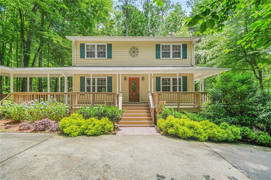 Lakeside oasis on 1.7, private acres in the heart of Marietta! Enter across the breezy, wraparound porch and turn to look across the private and beautifully landscaped front yard. Step through the front door to find the open concept living space, which offers an fireside family room, a formal dining room and an office that could be converted to an additional guest bedroom. Follow the hardwoods to the eat in kitchen with it's new, stainless stove and microwave, an abundance of knotty pine cabinetry and an eat in / breakfast area. Pass through the kitchen to yet another living space...an oversized great room with a vaulted ceiling and stacked stone fireplace. Make your way upstairs to the owner's suite with its updated ensuite bath. Two additional bedrooms and a full bath round out the upstairs. On the lower level, find another living and/or recreation space, including a large family room, guest space, plenty of finished and unfinished storage and a full bath with a new sink and shower. The best is still yet to come! Walk out onto the huge, screened back deck and look out over paradise. This is the best of outdoor living! Envision yourself enjoying morning coffee or an after work beverage on the enclosed porch and in the privacy of the trees, as you look out over your own, secluded lakefront. It doesn't get better than this. All of that and the peace of mind that comes with a new roof, new Aquaguard, gutter system and new garage door openers that go with the detached, two car garage. Don't miss the opportunity of enjoying your own, lakefront retreat in beautiful Marietta!