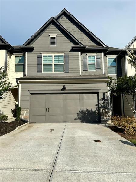 Available FOR RENT! Spacious 3 bed 2.5 bath Town house with luxury finishes. Minutes from Downtown Flowery Branch. Close to the lake, 985, shopping and the best entertainment areas. This three bedroom boast all the luxuries: granite, the large island in the kitchen, hard surface flooring, a cedar mantle fireplace, a fantastic primary suite, walking closet and very spacious secondary bedrooms. Laundry on the upper level. Attached TWO CAR garage will make this home perfect!