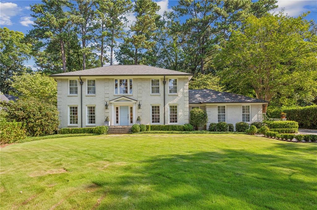 Charming Family Home in Historic Brookhaven. Beautiful 2 story foyer welcomes you with circular staircase, which is just one of the many special features of this home. Fabulous, light filled common spaces make this home an entertainer's delight. Foyer opens to a wonderful living room, large dining room and also to the fireside keeping room off the renovated kitchen, designed by architect, Frank Neely. Kitchen is complete with a banquet and breakfast area; walk in pantry; marble counters; and casement windows that open to the back patio. Fabulous vaulted, fireside (with antique Savannah brick surround) family room addition designed by William T. Baker. There is also a comfortable den with tongue and groove ceiling ; built ins; complete with 2 desk spaces and plenty of space to lounge around and get comfortable! Guest suite with renovated marble bath with zero entry shower. There is also an entrance from the rear to a spacious mudroom. Upper level has spacious primary suite and 2 additional bedrooms and adorable renovated bath. You do not want to miss seeing all the great spaces and detail in this home.