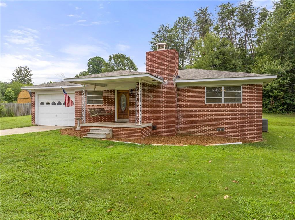How far do you want your money to go???The best value for your money....Come on home to this beautifully renovated 3 bedroom 1 bath 4 sided brick ranch. The stunning brick fireplace greets you when entering through the front door. The oversized kitchen is perfect to host the family gatherings and the upcoming holidays. The front porch swing is ready for you to come and make memories in. Also has a 30x40 garage all sitting on 1.65 acres. Come walk this fully renovated ranch home and dream of all the good things that will come if you lived in this home.