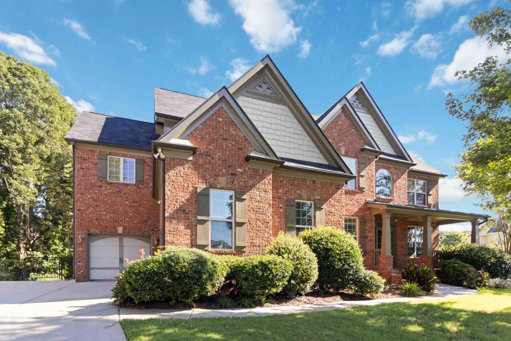 Stunning Brick-Front Home in Gwinnett County - Backing to Mulberry Park! Welcome to this elegant two-story home nestled on a quiet cul-de-sac in sought-after Gwinnett County. 2-story brick front - this home offers an abundance of space, style, and high-end finishes throughout. Step into a grand 2-story foyer that sets the tone for the rest of the home. The inviting family room boasts a coffered ceiling, custom built-in bookcases, and one of three fireplaces, creating a cozy and sophisticated space to relax or entertain. The heart of the home is the expansive kitchen with a huge center island, ideal for gatherings and culinary creations. Enjoy meals in the separate dining room enhanced by an elegant tray ceiling, or unwind in the bright keeping room with its own fireplace perfect for morning coffee or reading. The luxurious primary suite is a true retreat with a fireplace, spa-like bath, and upscale finishes. Three spacious secondary bedrooms offer bathroom access, ensuring comfort and convenience for family or guests. Additional highlights include tile floors in all bathrooms and thoughtfully designed living spaces that blend comfort with sophistication. Don't miss this rare opportunity to own a home that combines classic charm with modern elegance, all on a private lot that backs to serene parkland.