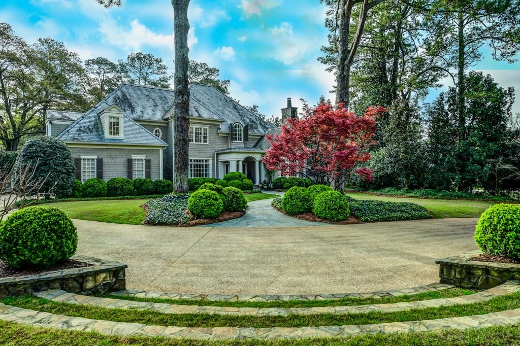 Customized by Norman Askins & Ladisic Fine Homes, this warm spacious home is enhanced by lovely architectural features such as barrel vaulted paneled ceiling in the foyer, antique doors into the master bedroom, octagonal patterned wood ceiling in the year-round porch, stacked stone fireplaces, & stone & antique wood mantels & built-in bookcases. Outdoor living spaces include stone terraces, alfresco dining & grilling area, stone & cedar pavilion w/stone fireplace, & exquisite pool w/separate sauna. 9 & 10 ft ceilings, hardwood floors & in-house sound w/intercom.