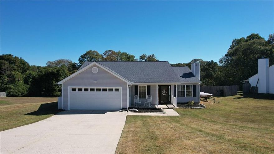 Charming ranch in a quiet Auburn neighborhood conveniently located near shopping, schools and major commuter routes. Perfect blend of comfort, style and convenience. This home features granite countertops, wood burning fire place, vinyl plank flooring, spacious master bedroom with vaulted ceiling, rocking chair front porch and covered concrete patio looking out across a large backyard with a fire pit, great for gatherings or quiet evenings.