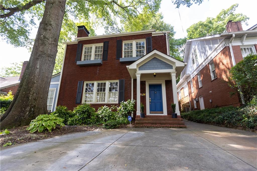 Prime Location! Beautifully updated 2 story brick home built in 1925 within walking distance to great shops & restaurants of Morningside. The interior features hardwoods throughout, 10'+ ceilings, crown molding, 3 fireplaces & original doors with glass knobs. Upstairs are the 3 guest bedrooms with full bath, laundry closet and stunningly appointed primary suite. The addition includes a full bath, oversized family room, keeping room, wet bar & a fireplace. Fabulous chef's kitchen is open with great flow to living areas & has stainless appliances, granite countertops, breakfast bar, abundance of cabinets & tons of natural light. Located just off kitchen is the timeless dining space with wainscoting detailing throughout. Separate living room offers built-in shelves with fireplace and leads to the sunroom with French doors opening to the side deck and spacious backyard with privacy fencing & large storage shed.