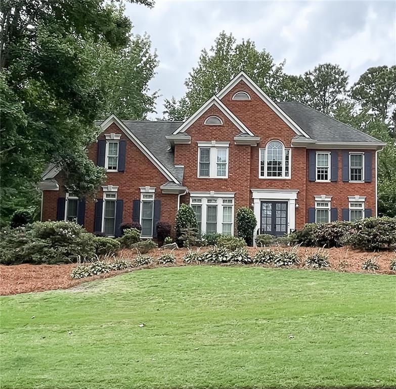 Welcome to this beautifully updated John Weiland–designed home in the popular Hamilton Commons neighborhood. With fresh paint throughout and a recently updated kitchen and bathrooms, this home perfectly blends classic style with modern comfort. Whether you're hosting friends or just relaxing with family, you'll love the open, functional layout and the warm, welcoming feel inside and out.
The gourmet chef’s kitchen features abundant cabinetry with under-cabinet lighting, granite countertops, a large center island, pantry, second vegetable sink, 6-burner gas stove, and stainless-steel appliances. The kitchen opens to a warm and welcoming family room with exposed beam ceilings, a brick fireplace, built-in shelving, and cabinetry. Double French doors lead to a generous wraparound deck, ideal for entertaining or relaxing. A secondary staircase off the family room provides easy access to the upper level.
Adjacent to the dining room, you'll find a serene screened porch overlooking the private backyard, which includes a playhouse, swing set, and irrigation system for both front and back yards. The main level also includes a private home office/study—perfect for remote work, as well as a convenient laundry room.
Upstairs, the luxurious primary suite offers hardwood floors, a tray ceiling, spa-like bathroom with soaking tub, oversized shower with five shower heads, dual walk-in closets, and an additional room currently serving as a second laundry area or flexible closet space.
The daylight basement provides additional living space with a media/gathering room, bonus bedroom, full bath, bar area, and plenty of storage.
Modern upgrades include a full-house Generac generator and a 240V Tesla charger for electric vehicle owners.
This thoughtfully maintained home is the perfect blend of luxury, functionality, and location—your new home awaits!