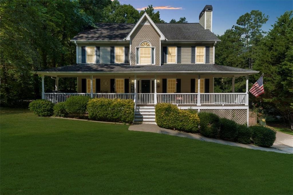 Welcome to 320 Warrenton Dr, a charming 3-bed, 2.5-bath home in Douglasville that perfectly blends Southern charm with modern updates. From the moment you arrive, the large rocking chair wrap-around front porch invites you to sit back and unwind. This well-maintained home also boasts a huge covered back deck—ideal for entertaining or quiet evenings outdoors. Inside, the spacious master suite impresses with vaulted ceilings, while recent updates include a newer roof, updated HVAC, fresh interior paint, and new carpet upstairs. The kitchen features warm brown cabinetry, durable laminate countertops, and sleek black appliances. Nestled on 1.36 acres with a partially fenced backyard and an unfinished basement offering endless potential, this property also comes with optional HOA participation—no fees, no rental restrictions, and total flexibility. This house is a must see! Schedule showing today!