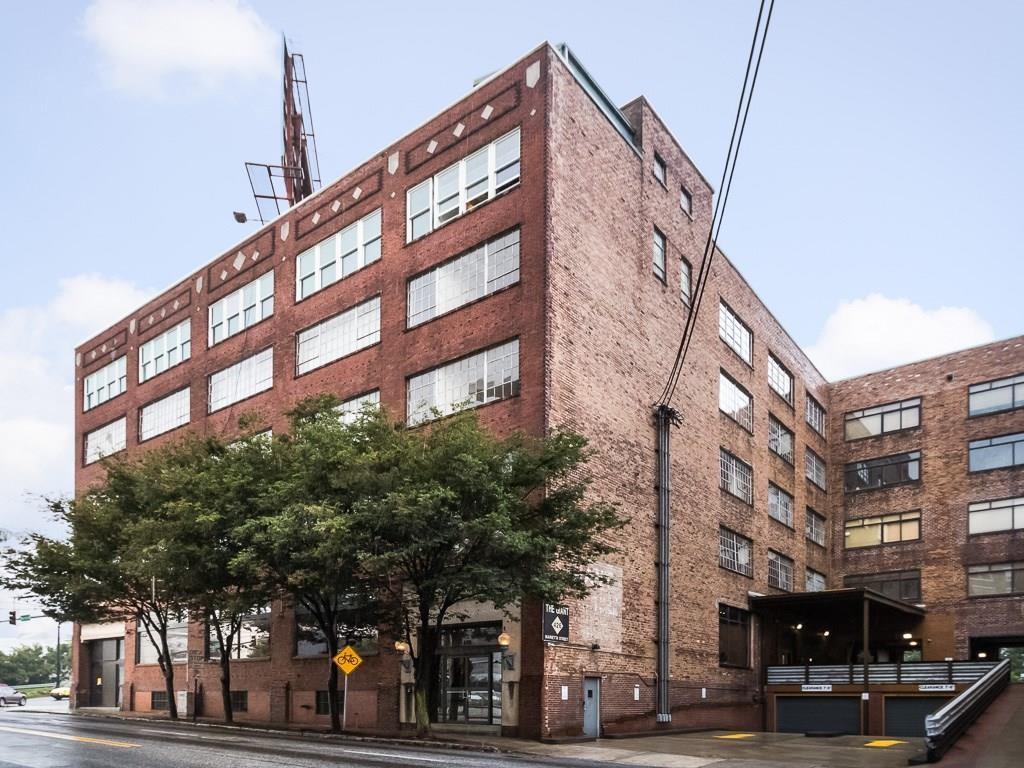 Authentic Loft in the heart of Downtown Atlanta ! Tons of light and views of the Mercedes Benz stadium and City views. The building is listed on the National Register of Historic Places -- it was built in 1910. Oversized space w/12 12-foot ceilings, concrete construction and floors, exposed brick walls, a kitchen with a breakfast bar, and a laundry room in the unit. Master bedroom with a walk-in closet and a large bath. Gated underground parking with elevator access to the secured building. Spectacular rooftop deck. NOTE - A second bedroom w/closet can easily be added. Easy walking distance to The Center (formerly CNN center), Centennial Olympic Park, & more.