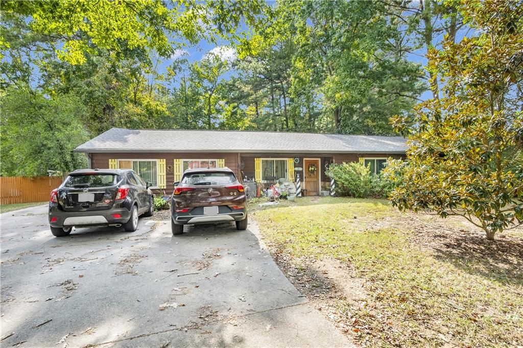 Charming Snellville Ranch with Endless Potential! Tucked away on a peaceful cul-de-sac in a quiet, established neighborhood, 3151 Grand Central Dr is a 3 bed, 2 bath one-story gem sitting on nearly half an acre. This home is perfect for anyone looking to add personal touches or investors ready for their next value-add opportunity. Featuring a private, tree-lined patio ideal for relaxing or entertaining, a handy shed for storage, and even a unique brick oven — this backyard is full of potential. Inside, the home needs a little TLC, but the solid layout and desirable location make it well worth the effort. Whether you're looking to flip, rent, or create your dream home, this Snellville property is a hidden opportunity you don’t want to miss! Some photos have been virtually staged to illustrate potential furniture placement and to digitally remove personal items or clutter; the home is not currently furnished as shown.