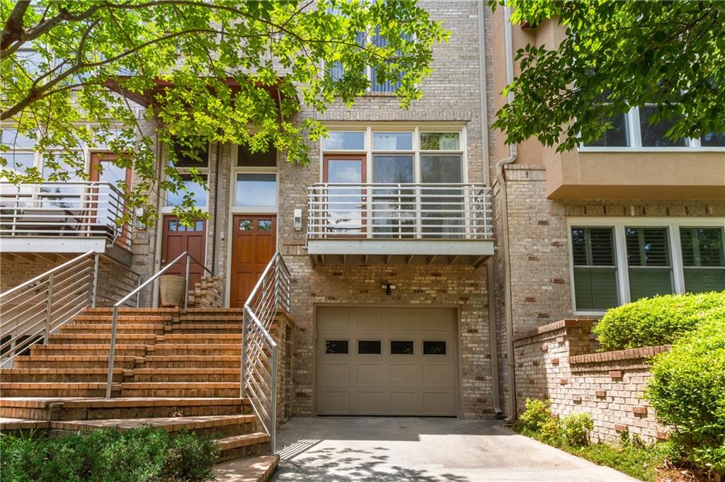 Sophisticated Townhome in the Heart of Brookhaven in Highly Desirable Fernwood Park Community. Located a One Mine Walk to Everything Brookhaven has to Offer; Boutique Shops, Restaurants, Retailers, New Friends & Good Times. Private Gated Backyard That Backs Up To Fernwood Park with Walking Trails, A Bridge & Tons Of Privacy. Extensively Renovated Throughout Featuring; High Ceilings, Hardwood Wood Floors, New Roof, New HVAC, Water Filtration System. Designer Light Fixtures & All New Recessed LED Lighting. Two Story Foyer. Formal Dining Room with Wall of Windows & Door Leading To Your Own Private Balcony Overlooking Your New Neighborhood with Sidewalks & Plenty of Pedestrian Traffic. Separate Powder Room. Stunning 3 Level Floating Steel Staircase & Handrails That Are Flooded with Natural Daylight via Skylight. Authentic Brick Interior Wall.All New Modern White Kitchen Featuring New Cabinets, Quartz Counters with Waterfall Edge, Stainless Steel Appliances, Red Tile Backsplash, Specialty Cabinet Inserts. Kitchen Opens To Spacious Living Room Complete with Fireplace & Ceiling To Floor Windows & Door Leading To Your Private Gated Backyard With Deck, Mature Landscape & Iron Gate Facing The Community Park. Upstairs Features A Generous Owners Suite with Wall of Windows. New Master Bathroom Suite with Floating Double Vanity, New Custom Tile To The Ceiling, Frameless Glass Shower, Separate Tub. Private Water Closet & Huge Customized Walk In Closet. En-Suite Guest Bedroom & New Modern Shower.. Laundry Room with Included Washer & Dryer. Terrace Level Features A Large Bedroom/ Home Office/ Home Gym with New Half Bath. Large 2 Car Tandem Garage With Painted Floor, Plenty of Storage & Workspace. Bedroom/Den downstairs is equipped with own private half bath. Won't Last!