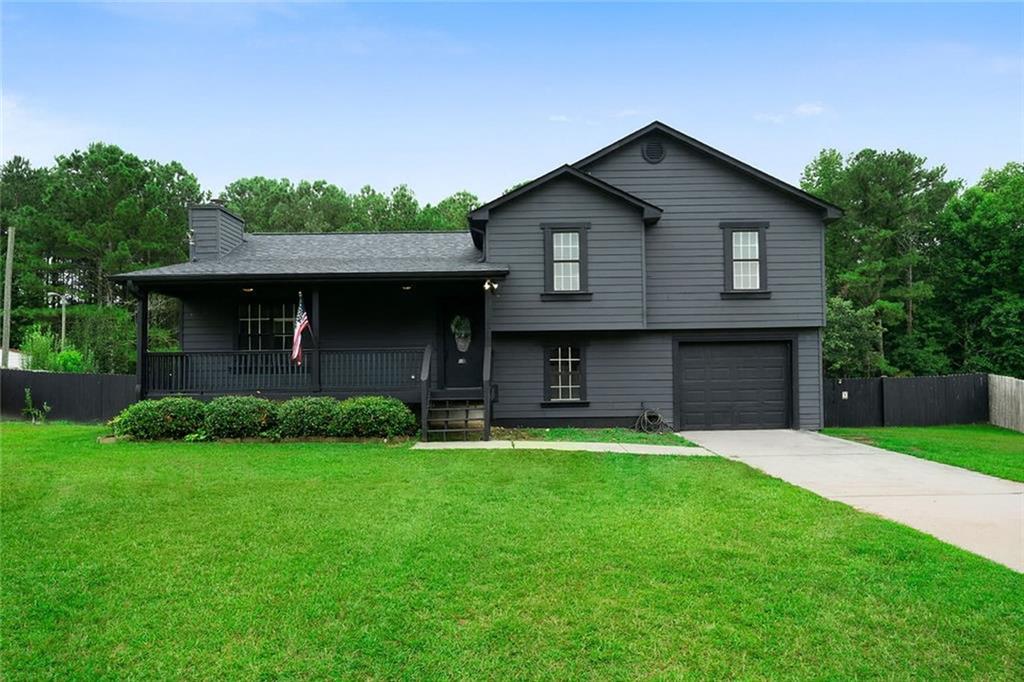 Step into this inviting split-level home featuring an oversized living room with a cozy fireplace, perfectly open to the dining area—ideal for entertaining or relaxing nights in. Upstairs you'll find 3 comfortable bedrooms and 2 full bathrooms, while the lower level offers 2 additional bedrooms, a laundry area, a 1-car garage, and a finished storage room completed in 2025. This home has been thoughtfully updated with NEW siding, black stainless appliances, exterior paint, and an attic fan (2024), a NEW roof and garbage disposal (2023), plus a screened-in back deck and a 6-foot privacy fence added in 2022. The interior also boasts fresh paint throughout for a move-in-ready feel. Enjoy the lush and level front and fenced backyard, perfect for entertaining, pets, or play. Conveniently located near major roadways, dining, shopping, and medical facilities—this home has everything you need. Don’t miss your chance—schedule your tour today!