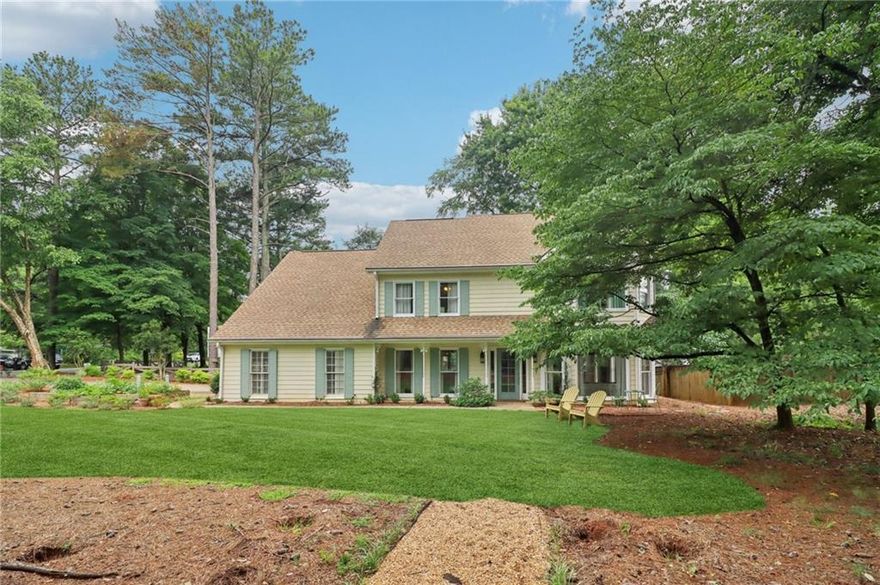 Exceptionally maintained and full of character, this stunning craftsman-style home blends timeless original details with thoughtful modern updates, and NEWER HVAC, all while being situated on a beautifully landscaped corner lot in prime East Cobb, zoned for top rated schools. A welcoming covered rocking chair front porch and manicured lawn set the tone for the quality and care found throughout. Inside, gleaming hardwood floors, detailed trim work, stylish fixtures with medallions, and a classic brick gas fireplace bring warmth and sophistication. The formal dining room, currently serving as a home office features elegant wainscoting and flows into an eat-in peninsula kitchen with granite countertops, stainless steel appliances including a wall oven and gas cooktop, vent hood, and a complementary tile backsplash. An additional casual dining area, family room, and adjoining formal living room create an ideal main level layout for everyday living and entertaining. Upstairs, the spacious primary suite boasts a double vanity, frame-less glass shower, soaking tub, and private water closet. Three generously sized secondary bedrooms, a full bathroom with skylight, and a dedicated laundry room complete the second level. The finished third level features two versatile bonus rooms, perfect as additional bedrooms, playroom, home office, media or reading rooms. Endless possibilities! Step outside to a serene backyard featuring a charming gravel patio lined with brick pavers, a cozy pergola, and even an adorable tree house!! No HOA and just minutes from popular shopping, dining, grocery, healthcare, parks, and year-round entertainment. This is a rare East Cobb gem that truly offers it all.