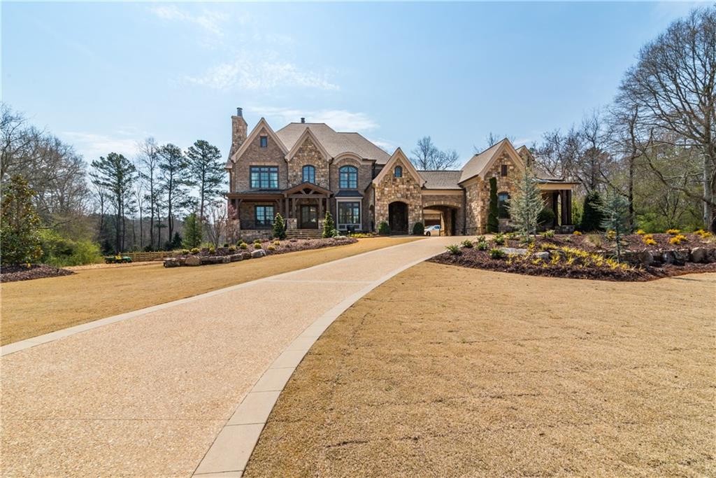 EXCLUSIVE RESIDENCE IN MILTON. This is Mayfair Estates signature home and features everything. Full home automation with an RTI system and Lutron lighting. Walnut floors , masonry fireplaces, quartz kitchen island and backslash, Elevator to all 4 floors, separate detached office and a half million dollar plus theater room that is one of its kind in the Southeast. This is a must see. Please contact Chip Russell to schedule a private appointment and viewing. Lots are available and Black Car service from inside the perimeter is an option.
