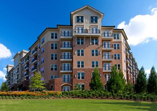 5th floor condo At Serrano with porch overlooking resort pool, gathering and grilling zone. Entire condo has been painted and ready for new tenant. Carpet in bedrooms professionally cleaned as well as entire condo. Tiled baths, separate laundry room including washer/dryer, plus stainless steel appliances in kitchen including refrigerator plus wine rack. Condominium has dramatic Brazilian hardwood flooring in family /dining rooms plus kitchen. Bar in kitchen overlooks family room plus built-in desk area and dining/flex room with block tiles. Serrano has a gathering room with bar, kitchen, TV, fireplace, tables and sitting areas. Enjoy the steam room , exercise facilities, beautiful pool in the center of the complex, and grilling area. Updated theater room also available. your rent also includes the high speed 1 Gbps internet. Two assigned covered parking spaces in the secure garage and mail delivery inside building. NOTE: paint is now all the lighter color. Some pictures included with previous paint darker shade. The Concierge' is available 8-7 weekdays and 10-5 weekends. Great location at 400, close to shopping, restaurants, and Sandy Springs Performing Arts Center. Next to Mercedes Corporate Headquarters. Make sure you see the amenities on the 1st floor to appreciate what this building has to offer and the security of fenced parking and the Concierge. Move In or Out fee only if Serrano charges a fee to owner.