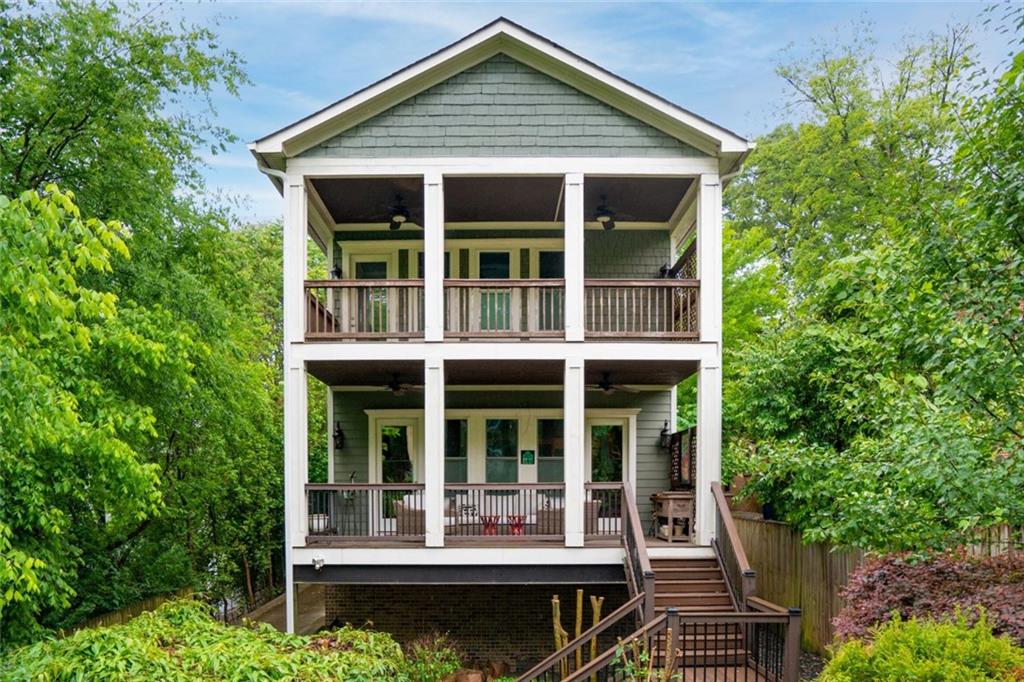 Centrally located in the heart of Virginia-Highland, this thoughtfully constructed home has it all! Open concept kitchen and living room with a dedicated dining room - perfect for entertaining. Enjoy high ceilings and oversized windows that provide an abundance of natural light. A private fenced-in yard and three outdoor living spaces to enjoy. With bedrooms on the first and third levels, there is plenty of space to spread out. The primary suite features its own porch, a beautiful walk-in closet, and a luxurious jacuzzi tub. Two car garage + driveway parking. 899 Greenwood is a fee simple attached dwelling that lives like a single family; unit B is located in the rear and has added privacy. Within close walking distance of Ponce City Market, the Beltline, and all of Virginia Highlands shops and restaurants. Easy access to I-75/85 and I-20 via Freedom Parkway.