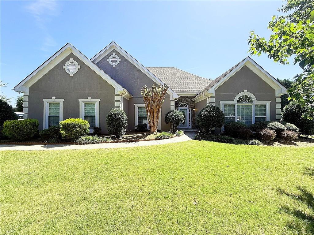 Immaculate Ranch Home in Sought-After Chestnut Lakes Community! Welcome to this pristine 3-bedroom, 3.5-bathroom ranch located in the highly desirable Parkview High School district in Gwinnett County. Nestled in the serene Chestnut Lakes neighborhood, residents enjoy tranquil ponds, scenic parks, and the charm of the historic Winn’s House. This beautifully maintained home features an open, seamless floor plan with hardwood flooring throughout the main level. Enjoy gatherings in the spacious living room or host guests in the separate formal dining room. The chef’s kitchen is a standout with granite countertops, ample cabinetry, and plenty of workspace. The oversized master suite offers a peaceful retreat with an primary bath featuring double vanities, a separate soaking tub, and a stand-alone shower. Upstairs, you'll find a private in-law suite with its own full bathroom—perfect for guests. The professionally landscaped front and backyard offer plenty of curb appeal and outdoor enjoyment. Conveniently within walking distance to Arcado Elementary School, this home combines beauty and location. Don’t miss this wonderful opportunity—schedule your private tour today!