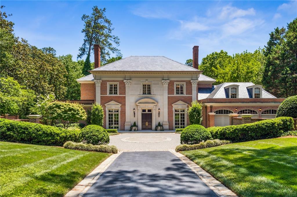 Custom Award-Winning Bill Baker design in coveted Tuxedo Park! This is one of Bill Bakers first signature estates and is an architectural landmark for the city and Tuxedo Road. Situated on a tranquil 1.3+ acre lot on one of the most sought-after streets in the city, this property offers mega privacy, an incredibly maintained and professionally landscaped yard and entry, multiple outdoor living spaces, English Boxwood Gardens, 6 fireplaces, a 3-car garage and a pool.
Enjoy entertaining in the magnificent formal dining room that connects to the kitchen. This chef's kitchen includes double ovens, two dishwashers, new high-end appliances, a gas cooktop, expansive kitchen island, a breakfast bar, separate wet bar, a breakfast room and opens up to the family room. The breakfast room views and opens to a lovely courtyard with fountain. Other features of the main level include exquisite moldings, enormous windows providing tons of natural light, a huge living room, lots of pocket doors and French doors, hardwood floors throughout, soaring ceilings, a beautiful light-filled library, powder room and full guest bathroom. The owner's suite is also located on the main level boasting a fireplace, sitting room, his and hers massive custom closets, French doors leading out to covered outdoor space, and a recently renovated bathroom with Marble and Onyx Floors, his and hers double vanities, a large soaking tub, walk-in shower and third make up vanity. Upstairs includes a private nanny or in-law suite, plus three more additional bedrooms all with en-suite bathrooms and large walk-in closets.
The finished terrace level impresses with loads of amenities including a Racquetball, Pickleball, or basketball court; a temperature-controlled wine cellar; a bonus room or game room; a playroom; a second wet bar kitchenette overlooking the downstairs family room; an office with a sitting room; a home gym; yoga room; second dryer hook up; a full bathroom with a steam shower and another powder room. Walk out from the terrace level to the expansive and fully fenced backyard and patio with an outdoor fireplace, fountain, grilling area, numerous outdoor living and dining spaces, gorgeous gardens and the recently resurfaced pool. This truly impeccable Estate pays tribute to its classical design while accommodating the needs and lifestyle of the modern southern family. No Sign.