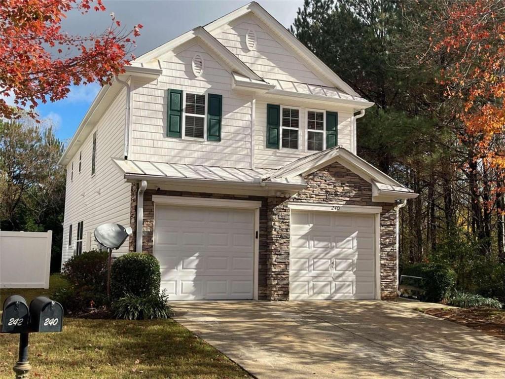 Welcome to 240 Silver Fox Trail, a 4-bedroom, 2.5-bathroom home located in the sought-after Silver Ridge community. . A $10,000 Down Payment Grant and $5,000 Closing Cost Grant is available to qualified Homebuyers through our Preferred Lender! Built in 2004, this renovated home is ready for your immediate occupancy. Enter through the covered front porch into the huge living room/dining room combination that features hardwood floors. Beyond the living room into the Family room with a fireplace and open view into the remodeled kitchen. Upstairs, the home features 4 bedrooms. The Master suite offers a peaceful retreat with a large walk-in closet and a private en-suite bath. Two large secondary bedrooms offer double-sliding door closets. The fourth bedroom, which measures approximately 14’ x 20’, could be a great in-law suite or game room. The second full bathroom and the laundry room complete the upper level, providing plenty of room for you and your family. Outside, you’ll find a level backyard and a 10’ x 10’ covered patio perfect for outdoor activities. The neighborhood amenities have so much to offer including a clubhouse, pool, lighted tennis courts, playground, and Silver Comet Trail access. The HOA maintains the front yards along with the community property. Highway 278 allows access to all your shopping and dining needs. Don’t miss the opportunity to make this move-in ready home your own. Schedule a tour today and see all that 240 Silver Fox Trail has to offer!