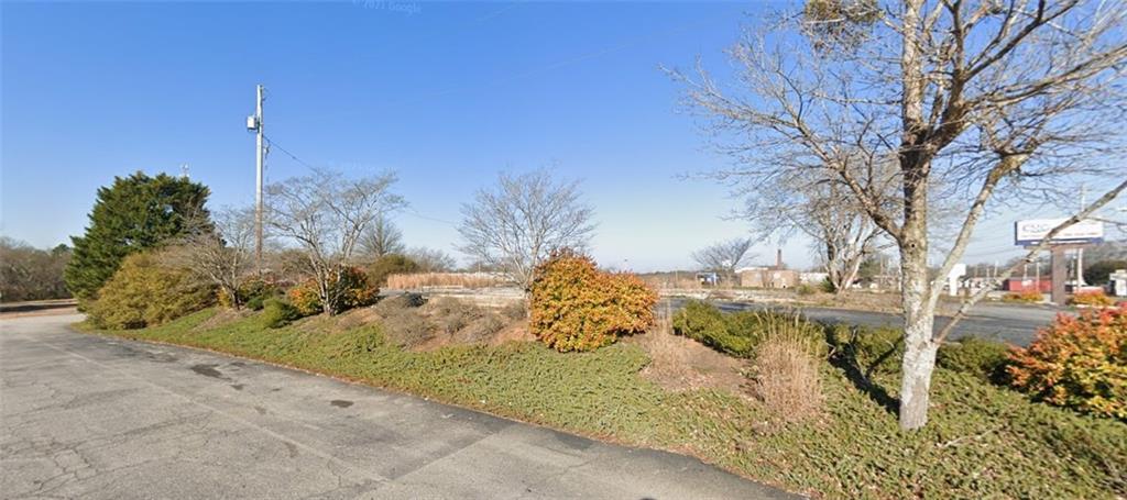 Commercial zoned 0.55 acre vacant Lot in Downtown Commerce. Slab, 16 parking spaces, and 2 drive-through lanes still in place. Public Utilities available. Lot is located next to Advanced Auto Parts. Lanier Technical College, Jackson County Habitat for Humanity & Restore, and Jackson County Health Department are located behind. Across the street is Grits & Grace Coffee House & Cafe and Texaco at Ila Rd.