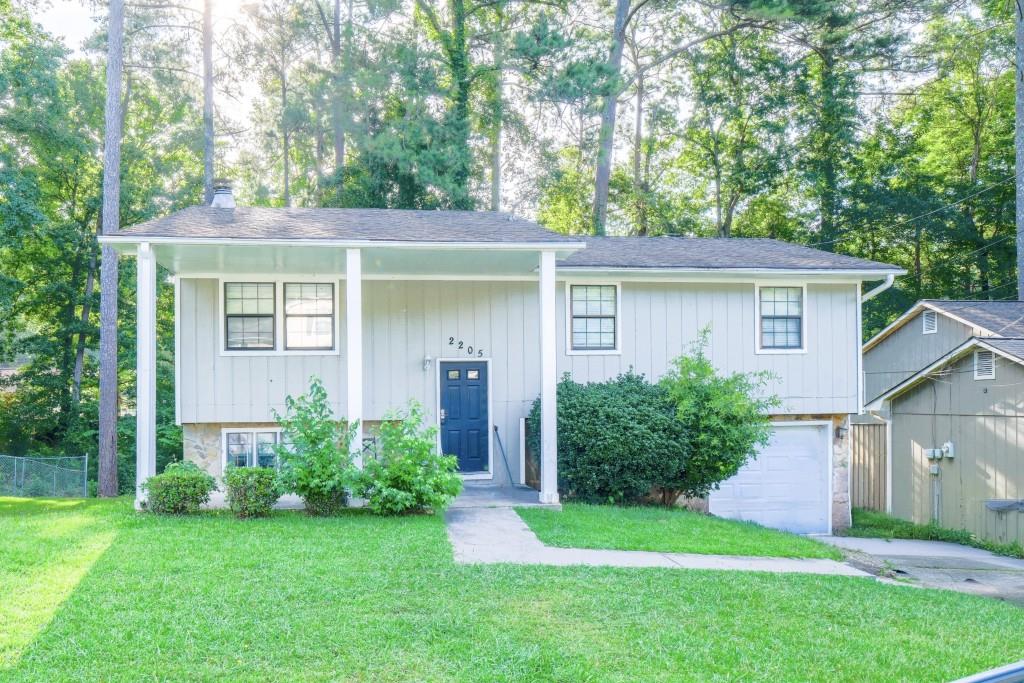 This 7-bedroom, 2.5-bath coliving investment property is located in a quiet, established neighborhood of Lithonia and features a practical split-foyer layout ideal for shared housing. A spacious living area provides room to gather, while full bathrooms on both levels support functionality for multiple tenants. With a layout designed to maximize occupancy, this property offers strong potential as a long-term rental. Based on average room rates and vacancy for the 30058 zip code, projected gross revenue is approximately $48,000 per year. Showings are restricted to common areas only; bedrooms are off-limits.