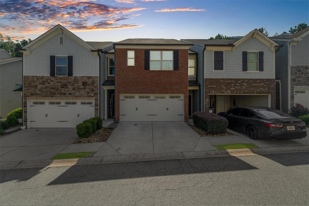 Welcome home to your new beautiful townhome in highly sought after Woodstock, Cherokee county. With upgraded counter tops, an accent wall in the family room, and a barn door at the hall bath, this adorable 3 bedroom 2 and a half bath is ready for you. Upstairs you will find a large walk-in closet perfect for all of your newly purchased fashions from downtown Woodstock boutiques. Relax in the garden tub and then cozy up for bed in this oversized master. Your kids or guests will enjoy the larger guest rooms upstairs conveniently located by your spacious laundry room. Your private back yard with accent lights is perfect for guests and with 2 garage spaces and room in the driveway, there's no reason not to invite a crowd! Come see all that this listing has to offer.