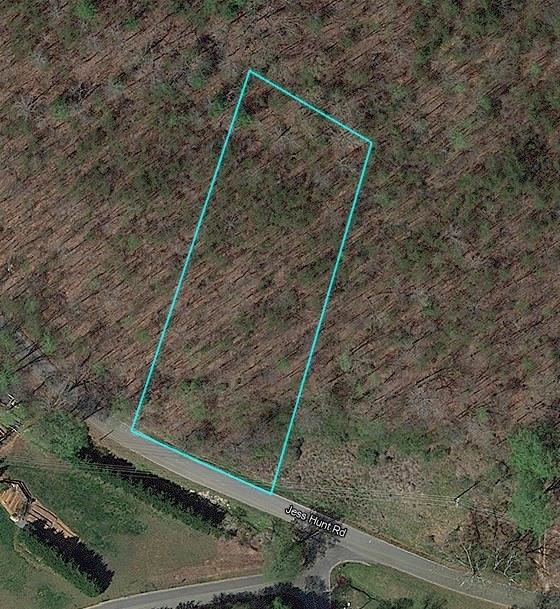 Rare 1.53-acre lot in the heart of Cleveland, GA, offering panoramic mountain views, privacy, and utilities—ideal for custom homebuilders or long-term investors. Located within city limits but tucked away in a quiet, elevated setting, this R1-Residential lot features city water, sewer, and power already available—no need for soil testing or septic installation. The land is recently surveyed and recorded, backs up to protected conservation acreage for lasting natural privacy.
Located just minutes from J.P. Nix Elementary School, local shops, and dining. With no HOA, a no-mobile-home policy, and zoning that supports future growth, this property offers a rare blend of build-ready convenience and strong investment fundamentals in a steadily developing North Georgia corridor.