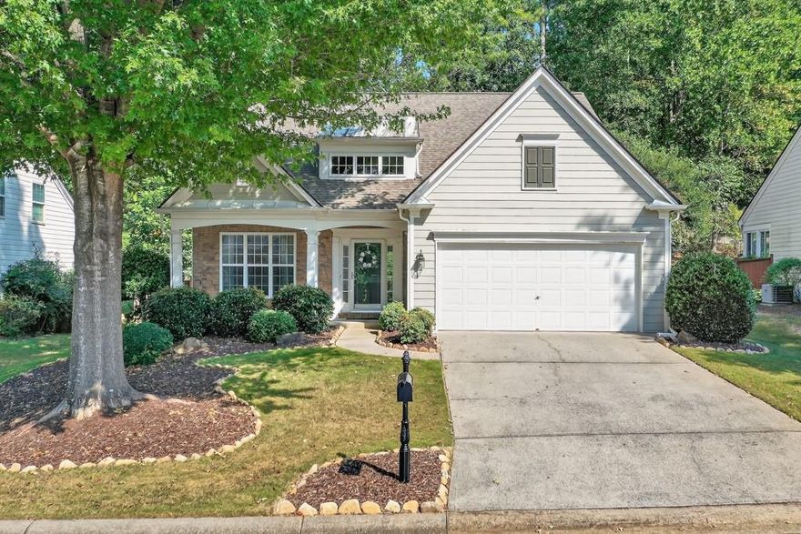 Welcome to the Woodlands and this Sought After Owner's Suite on the Main floorplan in "the Court"! The Main level features an Open kitchen with an eat in area, living room with cozy fireplace and separate dining room! ! The large primary suite features a double vanity and a generous walk-in closet.  The second level has Two great sized bedroom with full bath and a loft area perfect for a home gym, tv room or office! The Screened in porch offers a great place to relax! The Roof is only 4 years old! The Woodlands community is one of the best in Woodstock with Resort like amenities! Two pools, waterslide, tennis, pickleball, clubhouse, basketball & volleyball plus nature trails! This home is part of "The Court" section that does have an additional HOA fee of $65/month which provides lawn maintenance and weed control for low maintenance living!