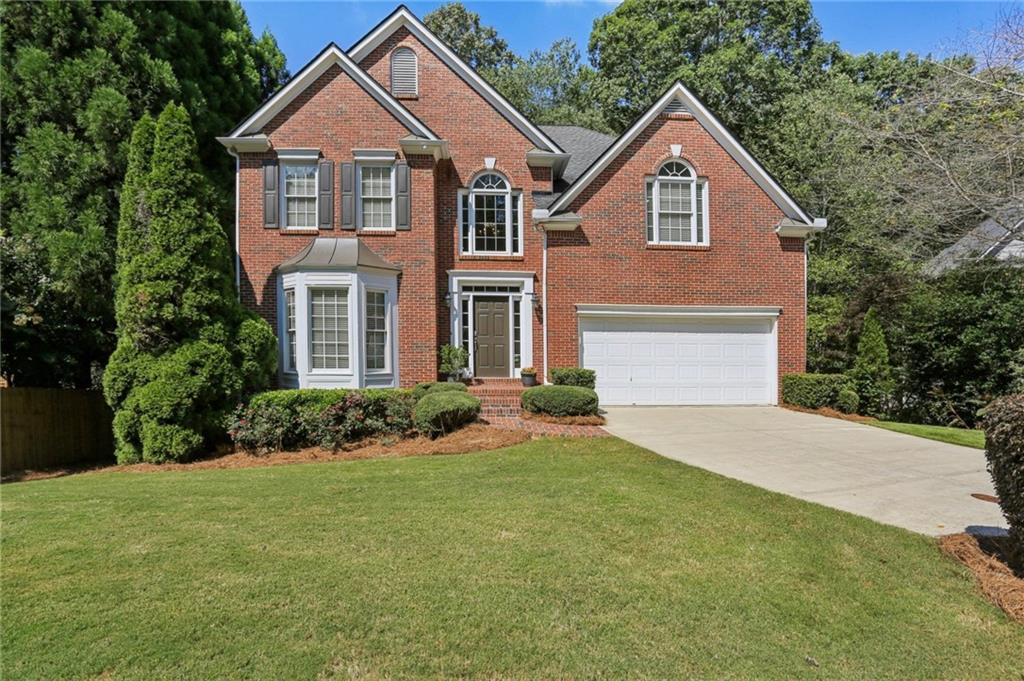 RARE CUL DE SAC GEM in Roswell's sought after Coleman Ridge Subdivision! With sophisticated decor, an open layout and a well designed floorplan, this 5 Bedroom, 4 Bathroom, Finished Basement home is an incredible opportunity! Upon entry, you are welcomed in to a two-story Foyer with an impressive staircase with wrought iron spindles. The attractive Living Room and spacious Dining Room are adjacent to each other showcasing the dark hardwood floors throughout the Main Level. The Kitchen is generous in size and also has a breakfast bar for quick meals or entertaining. The Kitchen has white cabinetry, stainless appliances, a gas top range and updated hardware and faucetry. The Breakfast Room is full of natural light with a bay window, and also a roomy pantry. The Family Room is anchored by an amazing stone hearth to the ceiling, cozy fireplace with gas logs, and square footage to allow for a large sectional for relaxing! This level has lots of natural light through windows high and low, as well as is well-lit at night with plenty of recessed lighting. A main level Guest Bedroom and Full Bathroom are highlights of this floorplan, along with a Laundry Room, Coat Closet and 2-car Garage. Upstairs is an oversized Master Bedroom with plenty of space for a sitting area or flex-space. The tiled Master Bathroom has dual vanities, a jetted tub, enclosed shower and the coveted his/hers separate closets! Across the open landing, are two additional Guest Bedrooms connected by a Jack-and-Jill Bathroom, each with individual sink rooms. Both rooms have generous closets, high ceilings and even a set of two built-in corner shelves! The Lower Level is a super usable and fun Finished Basement. With a Family/Media Room with Kitchenette, a Guest Bedroom, a Full Bathroom, an Office and a Workout Room, this home has so much extra living space! To the rear of the home is a Deck that overlooks a private, wooded and shaded backyard. There is a flat area ready for a playset, along with a fence the could welcome a pet! The front of the home showcases a picturesque level, grassy front yard, a wide driveway, with frontage to a flat, friendly cul de sac! Coleman Ridge is a warm, welcoming 62-home neighborhood built in 1998/1999, with an active Homeowners Association, and an optional access to Swim/Tennis with membership at the front intersection of neighborhood. This home is zoned for excellent schools, has an award winning park system, sidewalks to the Chattahoochee River area, and is such a short drive to retail with grocery, Starbucks, UPS Store, and more. A huge draw to this area is Historic Roswell known for Alive After Five, top restaurants, boutiques, galleries and unique cultural offerings so closeby! Don't miss out on this amazing home, come visit today!