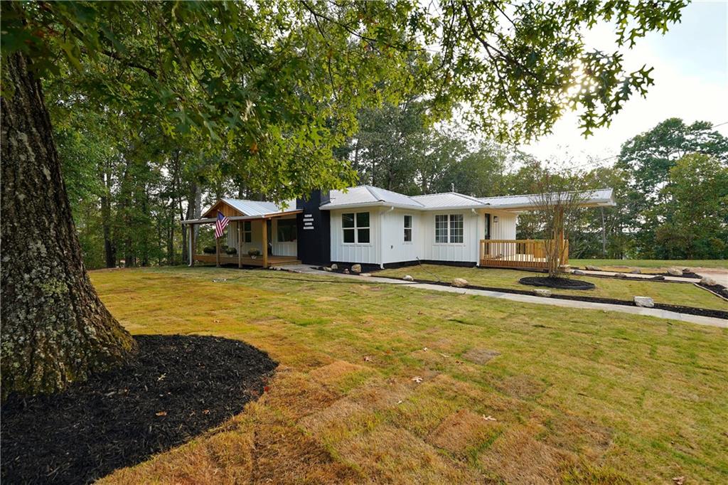 Country charm meets modern living! This fully renovated ranch on 1.55 acres offers privacy, space for a horse, and stylish updates throughout — all just minutes from Canton conveniences. Welcome to 1547 York Drive — a beautifully reimagined ranch home originally built in 1961, now completely transformed with modern updates while preserving its country charm. Nestled on 1.55 acres with no HOA, this property offers a rare blend of convenience and privacy. The backyard is partially fenced, spacious enough for a horse, and includes both an old barn and an additional storage building for all your outdoor needs.
Recent upgrades include new exterior gutters, nearly new HVAC, brand-new windows and doors, granite countertops, and durable LVP flooring throughout. Both bathrooms have been fully renovated, with the primary suite featuring a luxurious zero-entry shower. The huge front porch, shaded by gorgeous old trees, is the perfect place to relax and take in the peaceful surroundings. Fresh sod in the front yard enhances the curb appeal, while the open layout inside creates a welcoming flow. Move-in ready, modernized, and sitting on a piece of land you’ll be proud to call your own!