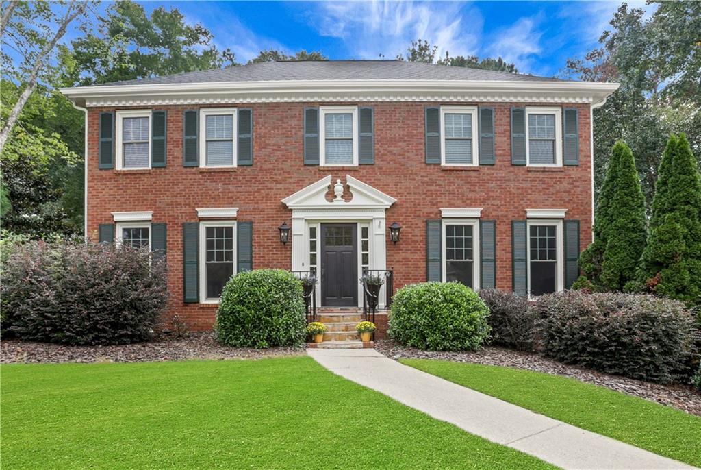JOHNS CREEK! THIS IS IT - PRICED TO SELL! Welcome home to this beautifully updated 4 bedroom, 2.5 bath residence located in the heart of Johns Creek, within the highly sought-after Northview High School district and just minutes from the new Town Center. Step inside to find fresh paint inside and out and gleaming hardwood floors throughout the main level. The chef’s kitchen is a standout, featuring a Thermador range with gas burners and electric oven, brand-new countertops, sink, and lighting. The kitchen opens seamlessly into the family room with a cozy fireplace—perfect for gatherings and entertaining.
Upstairs, the primary suite offers hardwood floors, a trey ceiling, and a luxuriously renovated bath with a soaking tub, glass shower, and walk-in closet. Three additional nicely sized bedrooms and full bath are also located on the second floor. Enjoy outdoor living year-round on the large screened porch (off kitchen) with refinished hardwood floors, overlooking a private, new custom fenced backyard. NEW ROOF-2025! Located near endless options for dining, shopping, and entertainment, this home truly has it all. No HOA. No rental restrictions.