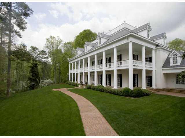 Perhaps Atlanta's most beautiful home. Oak Alley Plantation located in Louisiana was the inspiration for this custom estate home on 5.4+/- gated acre lot. 12' ceilings on 1st & 2nd floors. Heart pine floors, pool, spa, gazebo, formal gardens, & fountains. Also, 2 bedroom apartment over 4 car garage.