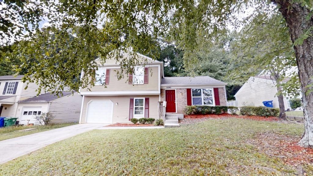 Welcome to this beautifully maintained 3-bedroom, 2-bath split-level home in the desirable Laurel Plantation neighborhood! Freshly painted throughout, this home features a mix of LVP, tile, and carpet flooring that adds comfort and style to every space. Enjoy a versatile layout with both a separate family room and a cozy den perfect for relaxing, entertaining, or setting up a home office. The family room includes a classic brick fireplace for added warmth and character. The kitchen offers white cabinets, granite countertops, and stainless steel appliances, making meal prep a breeze. The large primary bedroom includes an en-suite bath, providing a peaceful retreat at the end of the day. Step outside to a rear patio and enjoy a private backyard ideal for entertaining, gardening, or enjoying a quiet evening. Conveniently located with easy access to Hwy 78 and Hwy 285, and just minutes from shopping, dining, and schools this home combines comfort, space, and an unbeatable location. Don't miss your chance to make this move-in-ready gem your own!