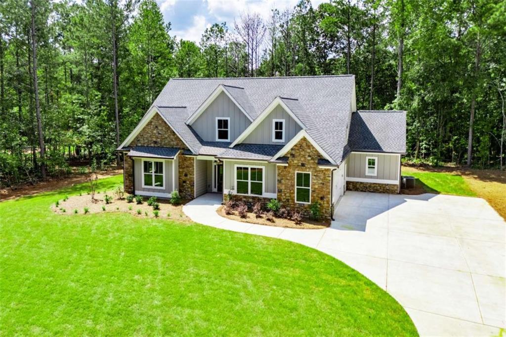 ** SUMMER BLOWOUT- Up to $20,000 in Buyer Closing Concessions w/ Acceptable Offer ** Exquisite new construction is complete & sure to impress! Beautifully situated on a large 3.093 acres in the highly desirable South Douglas area, this beautiful home has so much to offer. The Milledgeville- 4 bedrooms and 3 full baths with 3091 heated sq ft. The main level is loaded with all of today's most desired amenities - main level owner's suite, open concept living and dining areas, great kitchen - the list goes on and on. The flex room is perfect for overnight guests or a private home office. The upper level has two additional bedrooms that share a bathroom. The loft at the top of the stairs is spacious and adds another casual living area. There is also a bonus room off of the loft, that could be a number of uses. This beautiful home is one that you will not want to miss. Call today!