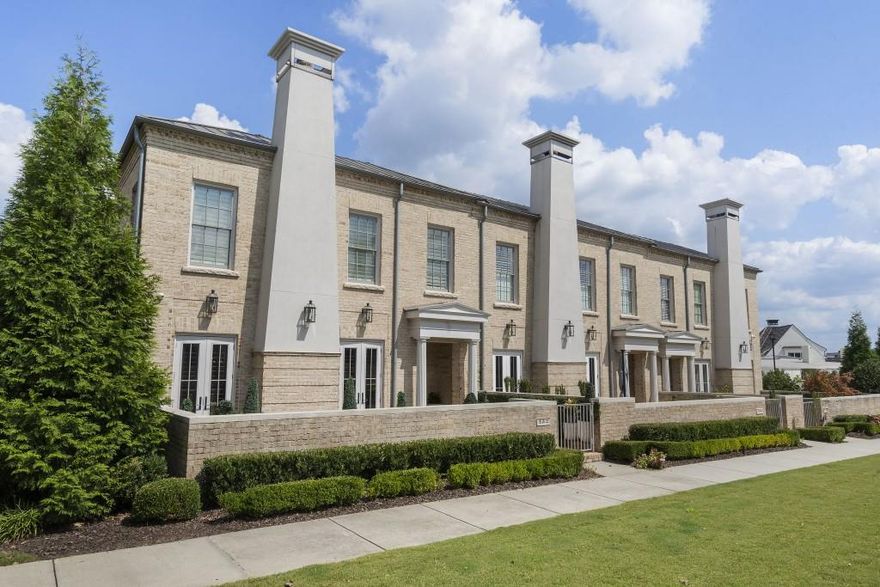 Custom European-Style End Unit Estate Townhome in Avalon - Alpharetta's Premier Mixed-Use Community! Welcome to an exceptional opportunity to own one of Avalon's most sought-after and popular floorplans - a custom-designed, two-story estate townhome situated in the heart of Metro Atlanta's most vibrant mixed-use community. This coveted end unit location offers enhanced privacy, with only one shared wall, and an abundance of natural light that fills every space. Ideally positioned in Alpharetta, this residence offers unrivaled convenience with easy access to GA-400, the Alpha Loop, and charming downtown Alpharetta - all just moments away. But life at Avalon is more than a home - it's a lifestyle. Enjoy the ease of resort-style amenities, world-class shopping, top-rated restaurants, and year-round entertainment events just steps from your door. Private community features such as a sparkling pool, and inviting gathering spaces create an elevated, low-maintenance living experience you will absolutely love. This like-new, all-brick estate townhome is a rare offering, showcasing nearly 3,700 square feet of thoughtfully designed living space, an impressive 30-foot wide floor plan, 10' high ceilings, and a spacious 3-car garage. The flexible layout includes 4 bedrooms and 3.5 baths, featuring both a primary owner's suite on the main level and a second owner's suite upstairs - ideal for guests or multi-generational living. Both suites offer generous custom closets for exceptional storage. Luxurious details are found throughout: rich engineered white oak flooring on both levels, a chef's kitchen with top-tier appliances and timeless designer finishes, and a gated front courtyard that creates a peaceful retreat perfect for outdoor entertaining or relaxing. The entire home has been professionally repainted with high-quality eggshell finish - an expensive upgrade that not only provides a beautiful soft sheen but also allows every wall to be easily cleaned and maintained, preserving the fresh, new feel of the space. To further elevate the home, all-new designer lighting fixtures have been installed, perfectly complementing the modern yet classic aesthetic. For the tech-savvy homeowner, a fully integrated Control4 home automation system manages audio, video, and smart home features seamlessly throughout the residence. Every detail - from the expansive, sunlit layout to the premium finishes - reflects superior craftsmanship and thoughtful design, making this residence both sophisticated and exceptionally livable. If you desire the perfect blend of location, luxury, and effortless lifestyle, this Avalon end-unit townhome stands unmatched - offering the finest in upscale Alpharetta living.
