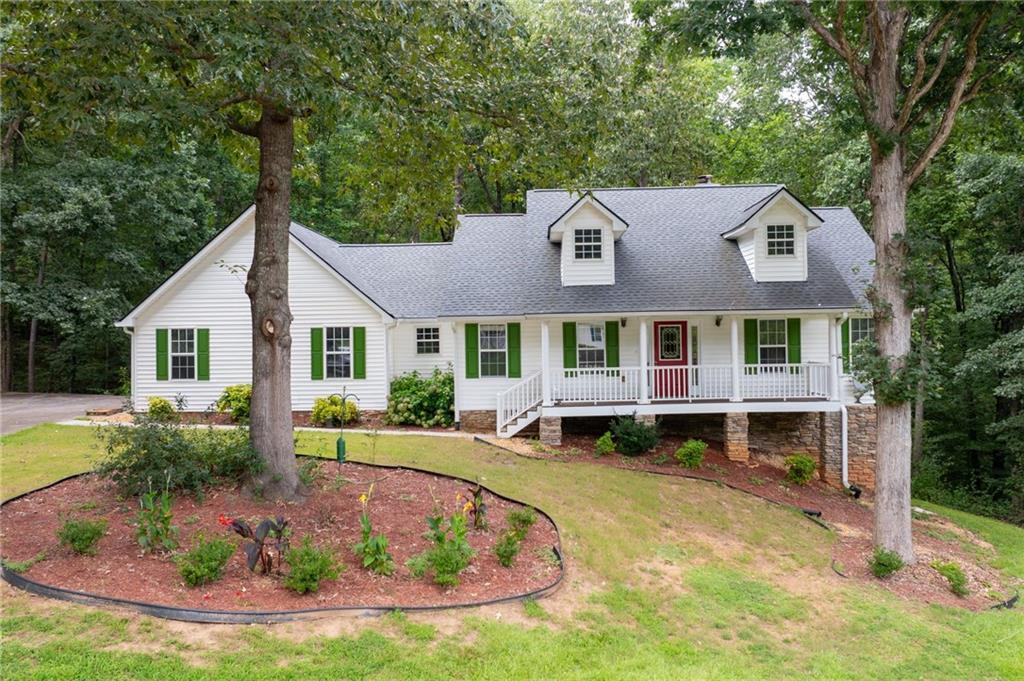 Welcome to this beautifully updated, one-owner home tucked away on a quiet cul-de-sac in Lithia Springs. Sitting on nearly 2 private acres and backing up to hundreds of acres of wooded land, this property offers the peace and privacy you've been looking for. Inside, you'll find a completely refreshed interior with all-new stainless steel appliances, brand new flooring throughout, and fresh, modern paint—truly move-in ready. The spacious layout includes three bedrooms, two and a half baths, and a large unfinished basement offering endless possibilities for expansion, storage, or a workshop. The open-concept living area is perfect for entertaining, and the kitchen is designed with both style and functionality in mind. A cozy fireplace adds warmth to the main living space, while the generous lot gives you room to roam, garden, or just enjoy the beauty of nature. With only one previous owner, this home has been lovingly maintained and thoughtfully upgraded. Tucked away but still convenient to I-20, shopping, and dining, this is a rare opportunity to own a private retreat with all the modern updates. Don’t miss your chance to make it yours!