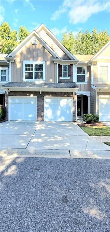 Welcome to a gorgeous townhome available now in the sought after Ellison Lake Townhome community with a LAKE VIEW-RIGHT ACROSS THE STREET! This home has been upgraded and well maintained by the owner and is Fee Simple ownership and offers the lovely feel of a single family home but without the upkeep - the HOA handles all of the lawn maintenance, swimming pool with fun mushroom spray fountain, fitness center, trash collection, water and sewer! Enjoy this array of amenities - easy and convenient living! The main level features a 2-story foyer with 2 display niches, a beautiful chandelier and hardwood stair treads, large fireside great room, open concept dining room, and the kitchen overlooks the great room! Don't miss the large storage closet in the foyer and guest bathroom! Stunning LVP flooring on entire main level, newer light fixtures and 2" blinds! Upgraded fiberglass front door and door to garage with blinds between the glass! Kitchen features granite countertops with stainless steel appliances and an undermount sink and disposal! Refrigerator is included! The dining area features a chair rail, detailed trim and glass doors leading to a private patio! Laundry room is the perfect mud room leading into the kitchen from the garage! Upstairs features an open bonus/loft/flex space-endless possibilities here, all with gorgeous hardwood flooring! The spacious owner's suite features a cathedral ceiling with 2" blinds! The ensuite bath features vaulted ceiling, walk-in closet, double vanity, large soaking tub, separate shower and private water closet! There are 2 additional spacious bedrooms and additional bathroom on this level! Brand new ceramic tiled floors in both bathrooms - stunning! Take note….New Roof and Water Heater! Don't miss this great home, just minutes to all the amenities of Kennesaw, Acworth and Marietta, including great shopping, restaurants, KSU, Kennesaw Mountain National Park, walking and biking trails! Ellison Lakes offers awesome amenities: Lake, Clubhouse, Fitness Room, Swimming Pool, Playground, Sidewalks.