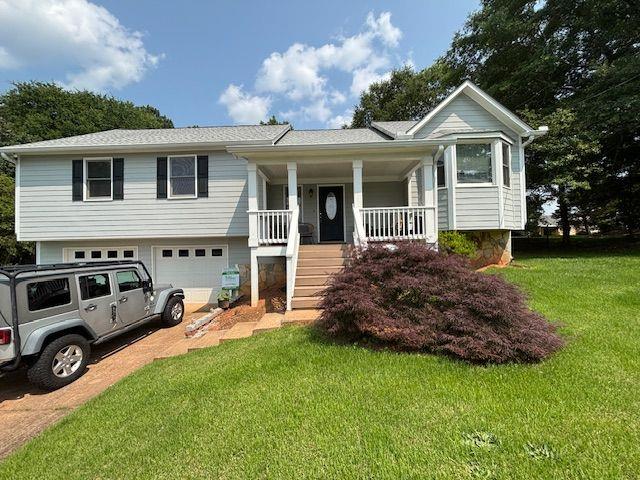 Gorgeous, excellent, well maintained home on private level wooded lot! This home has it all! Concrete siding with beautiful stone accents. Amazing front porch for relaxing. Tile kitchen & breakfast room. Dining room and Vaulted family room with hardwood floors. Master bedroom with his & her closets. Large master bathroom with double vanity, soaking tub & separate shower. 2 additional bedrooms on main & full bath with tiled floor. Finished Basement includes 2 bedrooms, great for office, playroom or exercise room & full bath with tiled floor. Basement also has additional closets for storage, utility room with workspace & utility sink. Huge 2 car garage. Plenty of room for additional storage or boat and has extra area for workshop. Long level driveway with plenty of parking. Amazing fenced backyard big enough to put in a pool, enjoy outdoor entertaining, great yard for kids to play & dogs to run. Award winning schools and close to shopping, restaurants and downtown Woodstock! NO HOA! This house will not last long!