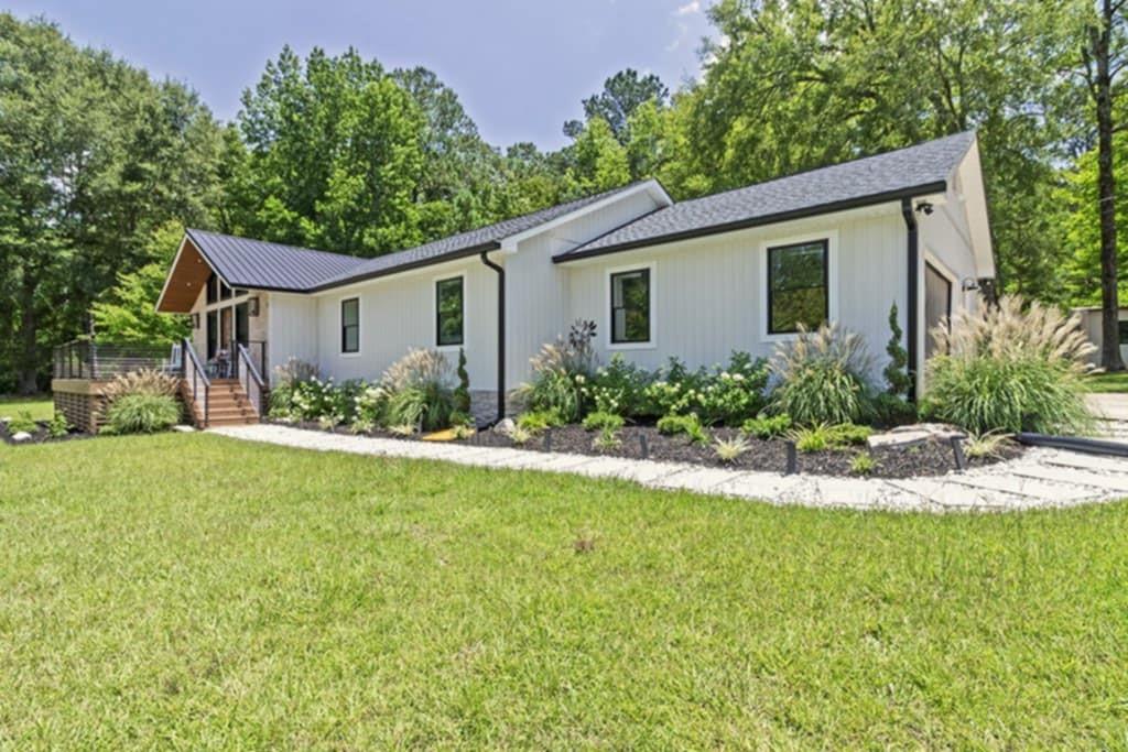 Welcome to this beautifully updated 3-bedroom, 2-bath home on over 3 private acres in an established, highly sought-after neighborhood-just off Riverside Drive and only 5 minutes from Bass Road. Enjoy peaceful living with quick access to shopping, dining, and I-75. Located in the Monroe County School District-one of the top-rated school districts in Georgia-this home offers the perfect blend of style, space, and location. Features include: Brand new roof, Board and batten siding, Spacious front porch with tongue-and-groove ceilings Inside, you'll love the open layout filled with custom finishes. The kitchen features quartz countertops, high-end appliances, and a wet bar with wine cooler-perfect for entertaining. The primary suite feels like a retreat, with a tiled walk-in shower, freestanding soaking tub, and floating vanity with gold accents. The second bathroom is just as stylish with modern tile and designer details. Other highlights: Stone fireplace, Custom dog-wash station Quiet setting. Top schools. Move-in ready. Schedule your private tour today!