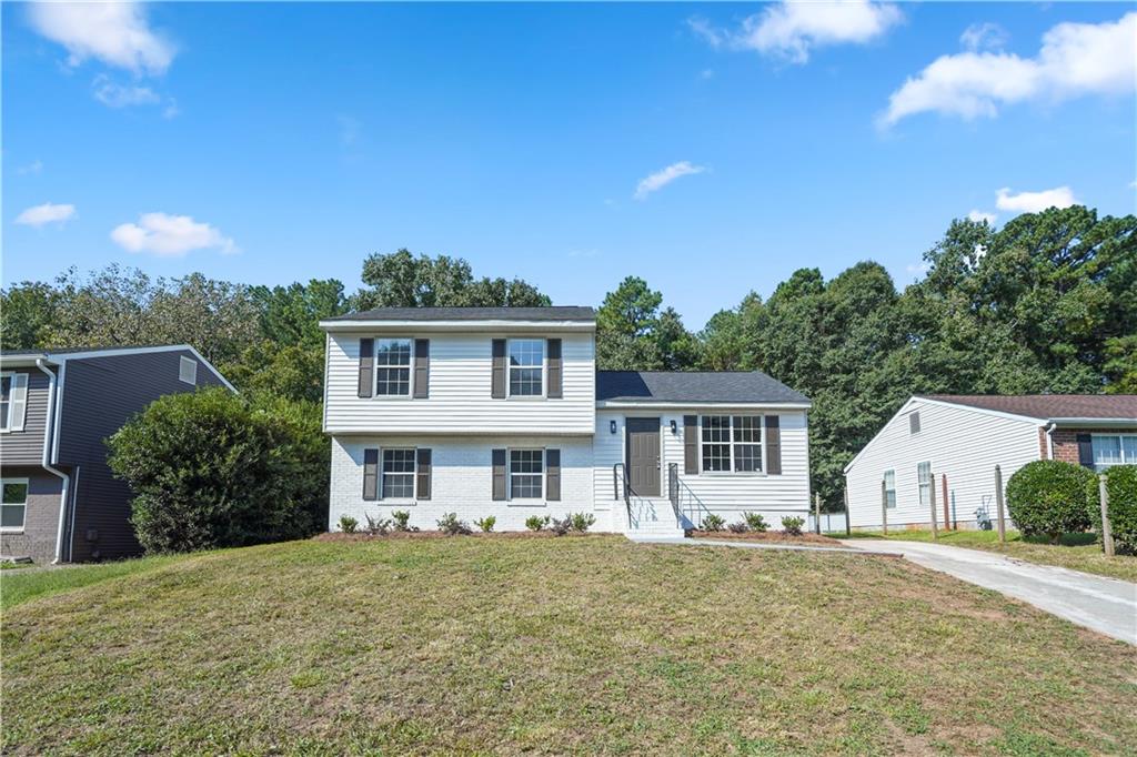 Welcome to your fully renovated 5-bedroom, 3-bath traditional-style home! Everything is brand new—from the roof to the kitchen, cabinets, bathrooms, flooring, and fixtures. Step into the foyer and head up to the main level, where you’ll find a spacious living and dining room combination flowing seamlessly into a bright see-through kitchen with white cabinets and granite countertops. Durable luxury vinyl flooring has been installed throughout, and the kitchen will be complete with a new dishwasher, microwave, and stove prior to closing.
Perfectly located less than 10 minutes from the airport and just 20 minutes from Downtown Atlanta, this home offers the ideal balance of convenience and tranquility. Tucked away in a quiet neighborhood, you’ll enjoy peaceful living while staying close to all the excitement the city has to offer. Don’t miss this perfect blend of comfort, space, and accessibility—schedule your private showing today!