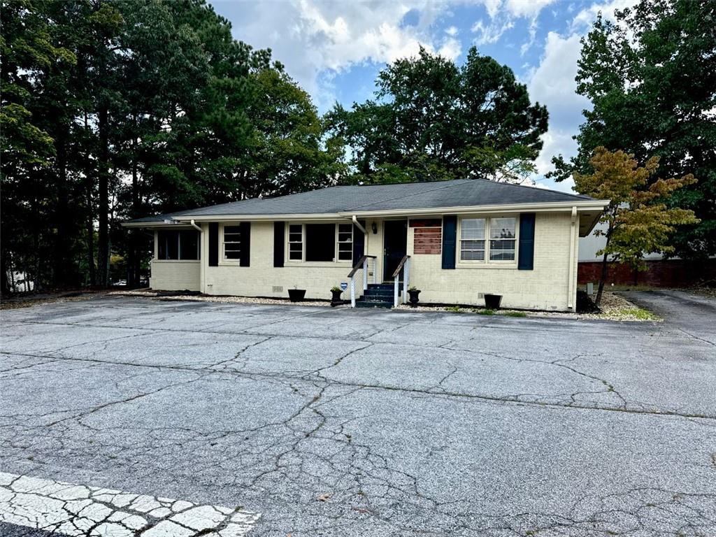 Welcome to 5464 Five Forks Trickum Road! This is the lease deal you have been waiting for. LOCATION, LOCATION, LOCATION! Wonderfully located on the busy Five Forks Trickum Road right near the intersection, this location markets any business on its own. Perfect space for any office, medical practice, insurance agent, chiropractic care, light retail, and much more. Ample parking space for customers, as well as a open entrance for easy access. Inside you get 1,347 square feet of usable space, with a front reception/ waiting area, multiple rooms inside for multi purpose, a kitchen area, and a bathroom. Additionally, there is more space out back for any extra storage or expansion needs. Remarkable location at an unbeatable price. 24 and 36 month lease options available.