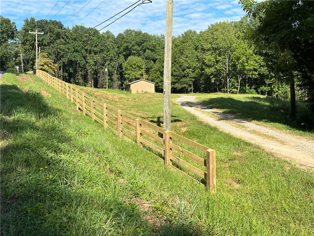 Rare opportunity to own almost 9 acres in highly sought after Cherokee County and Creekview ,Creekland , Avery School Districts with freedom to live life on your own terms. The possibilities are endless with these private 8.9 acres. Make it your dream home, horse farm, hobby farm or place of business. Large garage already in place that could easily be transformed into a barn, shop or even torn down for a clean slate. Septic in place and county water available. Come see for yourself all this property has to offer.