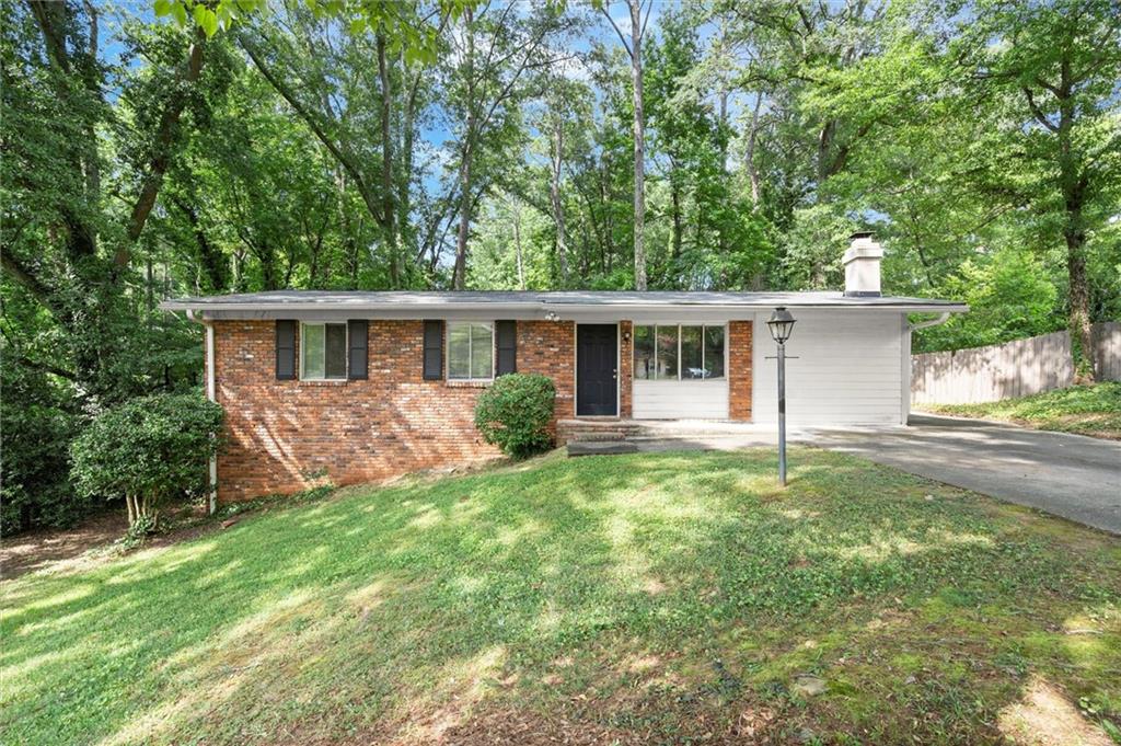 Fantastic investment opportunity just one mile from vibrant Downtown Roswell! This versatile home offers incredible potential with a fully finished basement featuring a second kitchen, laundry room, bedroom, and full bath—perfect for rental income, guests, or multigenerational living. Upstairs you'll find 3 bedrooms, a fireside family room, and a bright sunroom that opens to the back deck overlooking a private, half-acre lot. Nestled in a quiet, established neighborhood with no HOA, this property combines charm, space, and location—ideal for investors, renovators, or savvy buyers looking to customize and build equity. Great Roswell location just minutes to Canton Street, GA-400, parks, trails, schools, shopping, restaurants, and the brand new Southern Post!