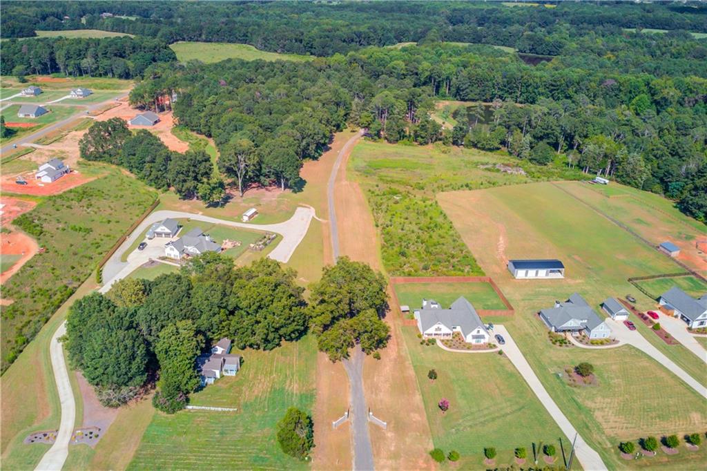 This hidden gem is tucked far off the road on 25 acres, offering complete privacy and tranquility. The property features a serene pond, open space for a large garden, animals, or your forever dream home. With enough road frontage for an additional two homes or a guest house, it’s ideal for a family compound, investment property, or future development (with county approval).
The custom-built cabin showcases beautiful craftsmanship by a local builder—featuring hardwood floors, built-in bookshelves, wood accents throughout, and a bar area perfect for entertaining.
Modern Comforts:
Whole-house audio system with zones for the porches, kitchen, bedroom, and office/bedroom—expandable to the pool and future outdoor kitchen.
App-controlled smart features for easy living.
High-End Kitchen:
Sub-Zero refrigerator
Wolf stove, coffee maker & microwave
Scotsman ice maker
Outdoor Living:
Gorgeous pool with plumbing & electrical in place for a future outdoor kitchen
Gas lighting on the exterior for a warm evening glow
This property is full of unique features you won’t find anywhere else—a true must-see!