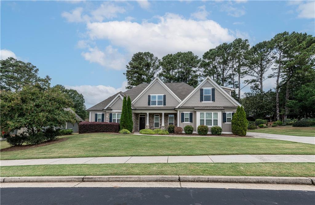 DOWNTOWN MONROE! Owner suite on the main level and an additional bedroom and full bathroom. This home was designed by Frank Betz and is the Glenview Plan which has been modified to add additional space and features. Upon entering, you will find a wide foyer with separate dining w/heavy trim. The great room has coffered ceilings and stacked stone fireplace with a custom mantle. The breakfast room is large enough to accommodate seating for 8. Upgraded appliances and walk-in pantry. The plan offers owner's suite on the main level. The large owner's suite has coffered ceilings and a large bath w/oversized shower/rain head and a custom closet. Garage is oversized and has walk in attic. Storage is amazing and the house has been beautifully maintained. Backyard is private with a tree line and fenced. The large, covered patio compliments the back yard and it's privacy.