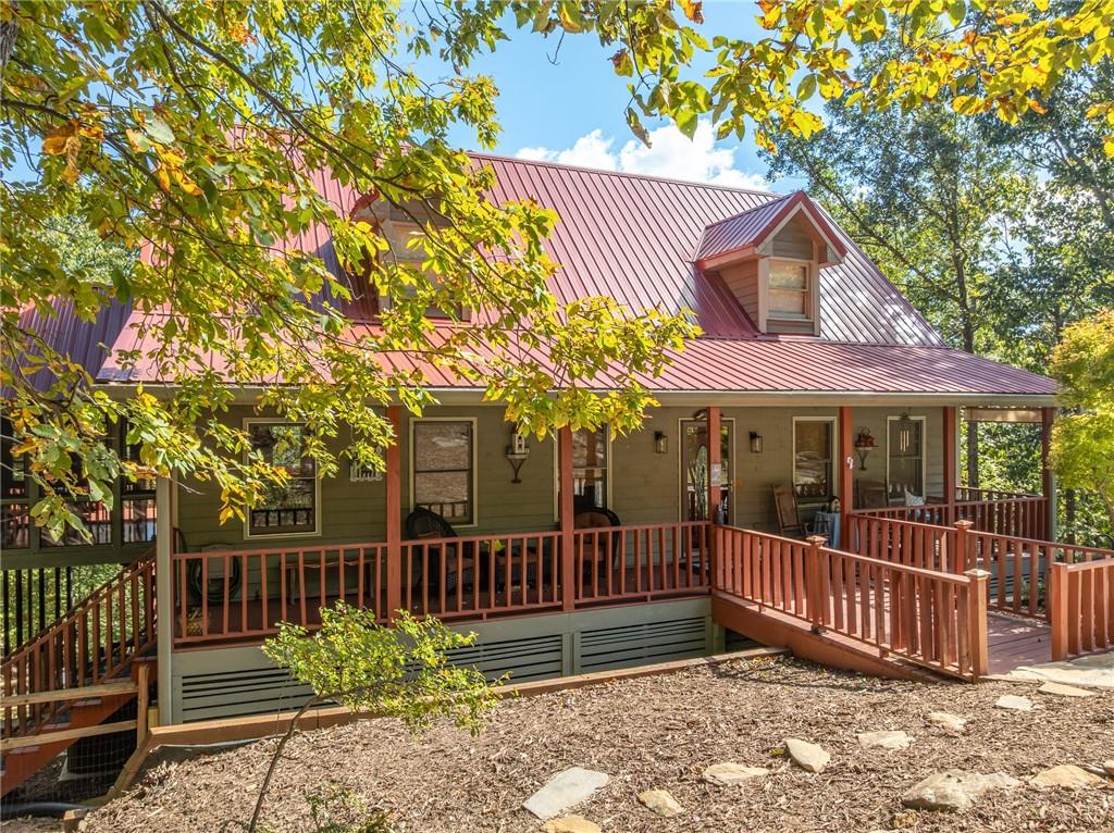 Welcome to 86 S View Trail in Jasper, GA! Nestled on over an acre lot, this charming home offers 4 bedrooms and 3.5 bathrooms. Enjoy a bright, open living space that seamlessly connects to dining and relaxation areas. The primary suite includes a private bath, while additional bedrooms provide flexibility for guests or a home office. Step outside to expanded decking with seasonal mountain and lake views. Recent updates include a new roof and expanded decking. This beautiful home offers convenient access via the back gate.
Located in Bent Tree, you'll enjoy amenities like an 18-hole golf course, swimming pools, tennis courts, a stocked lake, hiking trails, and more. With gated security, a fire department, and a community water system, it's secure and self-contained. Whether a primary home or vacation retreat, experience mountain living at its finest!