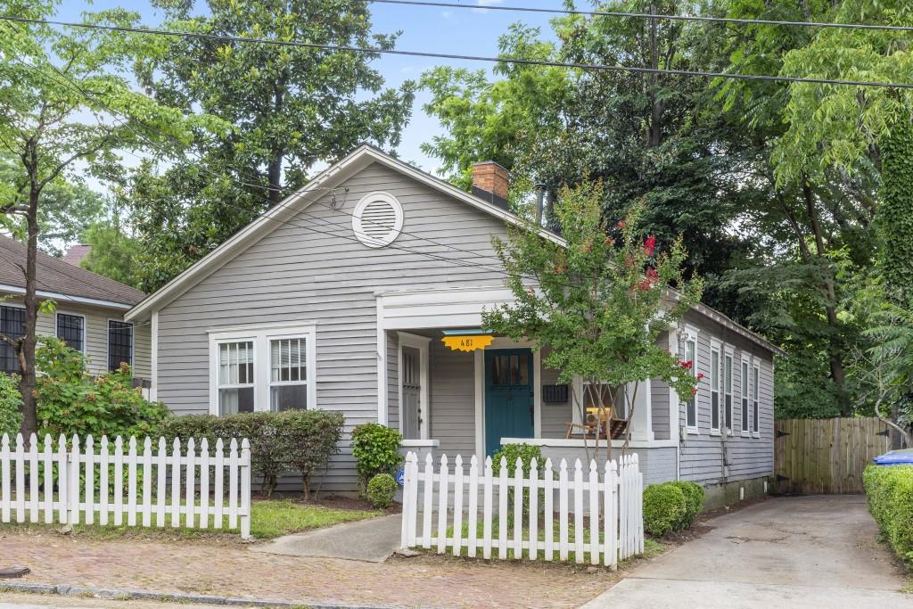 Welcome to this timeless, charming cottage nestled in beautiful Grant Park, offering a perfect blend of character and modern updates. You will love the open layout, highlighted by an abundance of natural light. The heart of the home lies the well-appointed kitchen, featuring white cabinets, granite countertops and stainless steel appliances. Adjacent to the kitchen is an open dining area, ideal for enjoying quiet meals or entertaining guests. The three bedrooms offer comfortable accommodations, and the primary bedroom features an ensuite bathroom with double vanities and spacious shower. Outside, a picturesque and private garden and deck area await, providing an outdoor oasis for al fresco dining, gardening, or simply soaking up the sunshine. Conveniently located near shops, restaurants, parks, and schools, this enchanting cottage offers the perfect blend of privacy and convenience.