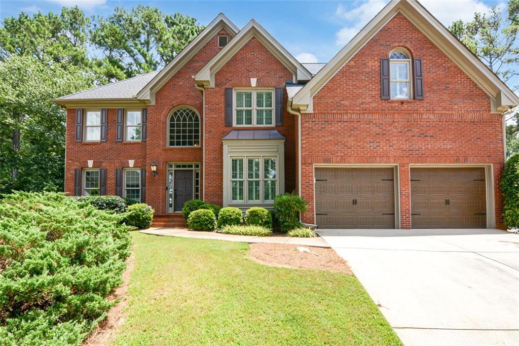 The right price, the right home - just waiting for you! Tucked away on a quiet cul-de-sac in the coveted Riverfield swim/tennis community, this beautifully maintained home checks all the boxes for both style and function. Inside, you’re greeted by hardwood floors, a welcoming layout, and thoughtful updates throughout. The formal dining room offers timeless charm, while the cozy fireside family room is ideal for movie nights or game-day gatherings. The spacious kitchen is as practical as it is pretty, with granite countertops, stainless appliances, and tons of cabinetry for storage. Need a quiet space to work from home? The private main-level office is ready for you. Upstairs, the spacious primary suite feels like a retreat with its recently renovated bathroom featuring a spa-like shower, dual vanities, and large walk-in closet. Three additional bedrooms offer space for everyone, one with a private en-suite and the others sharing a bathroom. Step out back to a screened-in porch with a wood-burning fireplace and gas starter—perfect for al fresco dinners, cozy summer nights, or your morning coffee overlooking the lush, level backyard. The finished terrace level with full bath is the perfect entertaining space with a media room, wet bar, and space for a pool table! Enjoy everything the community has to offer, from neighborhood events to pool parties and tennis matches. Double sidewalks throughout the entire neighborhood are perfect for strolls, bike rides, or walking to THE YMCA or The Forum! Located in the Simpson Elementary district and just minutes from shopping, dining, and year-round events at Peachtree Corners Town Center.