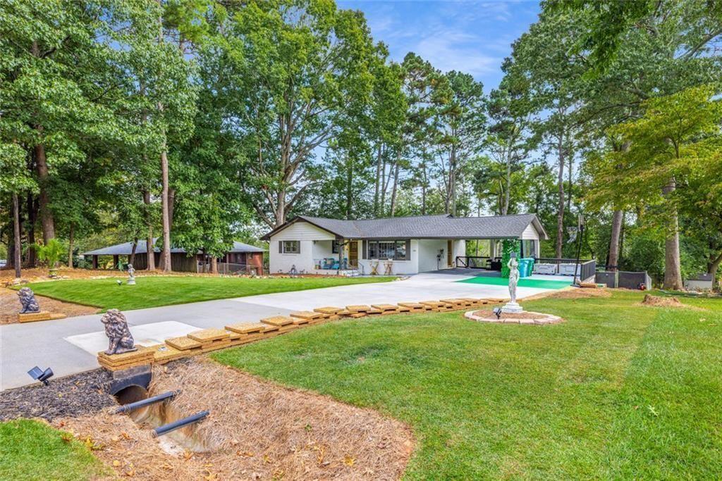 Beautifully updated Norcross home with upgrades inside & out! Features include a new driveway & repaired walkway, refreshed aluminum gates with locks, and a full landscaping overhaul with new sod, rock beds, pine straw, tree trimming, and an accent wall with lighting. Outdoor living shines with a fire pit, shed refresh, and decorative wood fencing. Major improvements include crawlspace encapsulation & roofline critter wrap, EV charger, screen security doors, and ornamental ironwork for style & security. Bonus touches: refinished terracotta porch tile, foam gutter guards, and septic recently pumped. Move-in ready with modern function and unique flair!