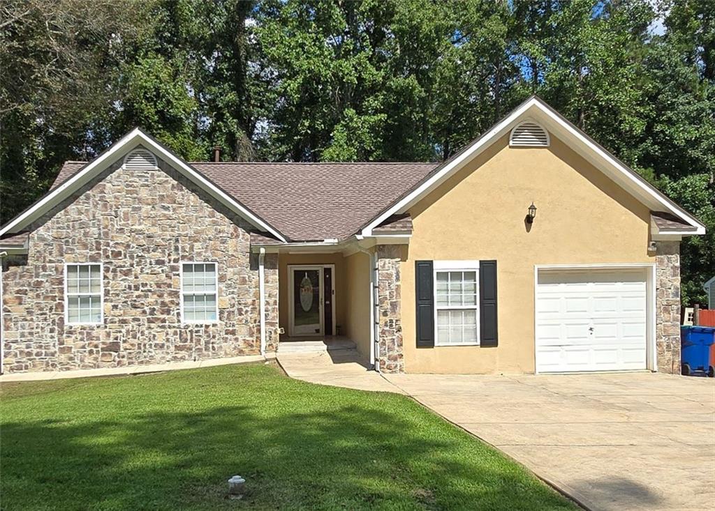 Welcome Home! This beautiful home offers 4 bedrooms, 2.5 bathrooms located in the wonderful
neighborhood of Milam Manor in a well-established community of Fairburn. This home provides
ample space for enjoyable living, features a living and dining room combo with a fireplace in
living room, kitchen with countertops galore, ceramic tile floor, and stainless steel appliances.
Enjoy grilling outside on the deck from dining room, all tile bathroom with separate tub and
shower, hardwood floors, one car garage, laundry area and hot water heater in garage and a
fenced back yard for privacy. Newer roof, privacy fence and new deck. This is a great opportunity to make this your dream home! This
won’t last long on the market.